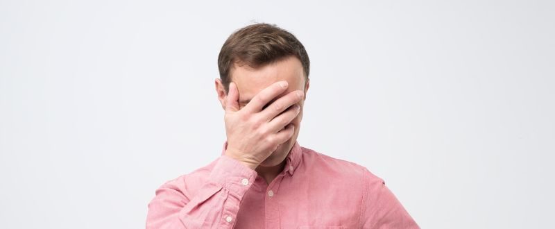 man embarrassed after replying all to an email by mistake